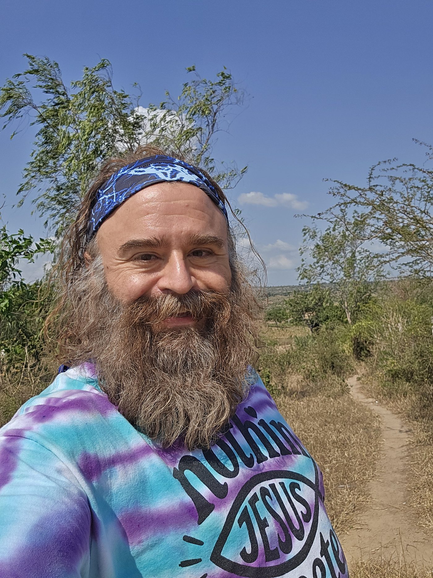 Joshua Ryan Purdy, smiling outdoors in Kenya